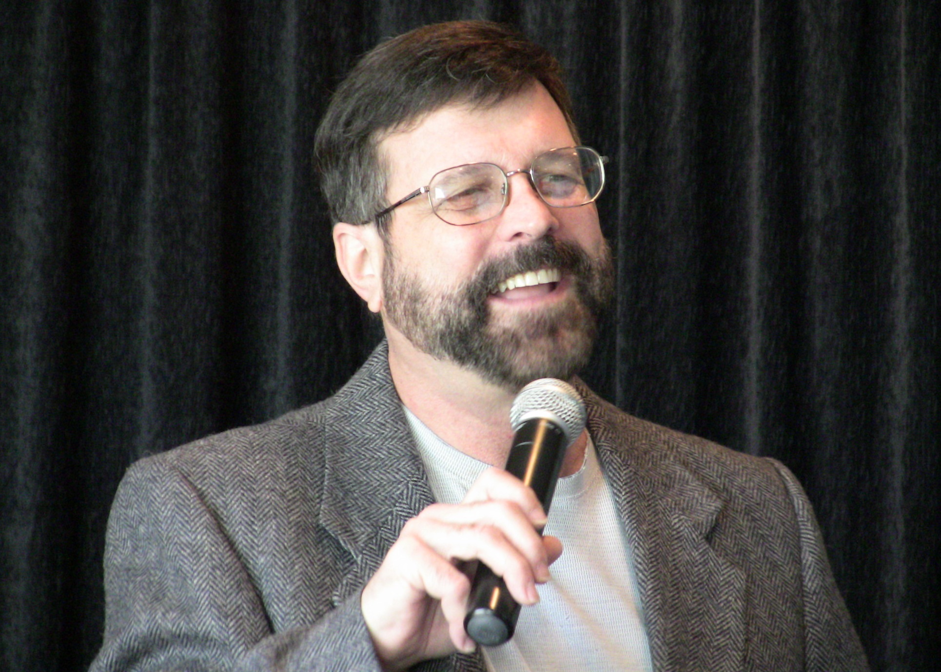 Hypnotist Talking to Students During His Hypnosis Show